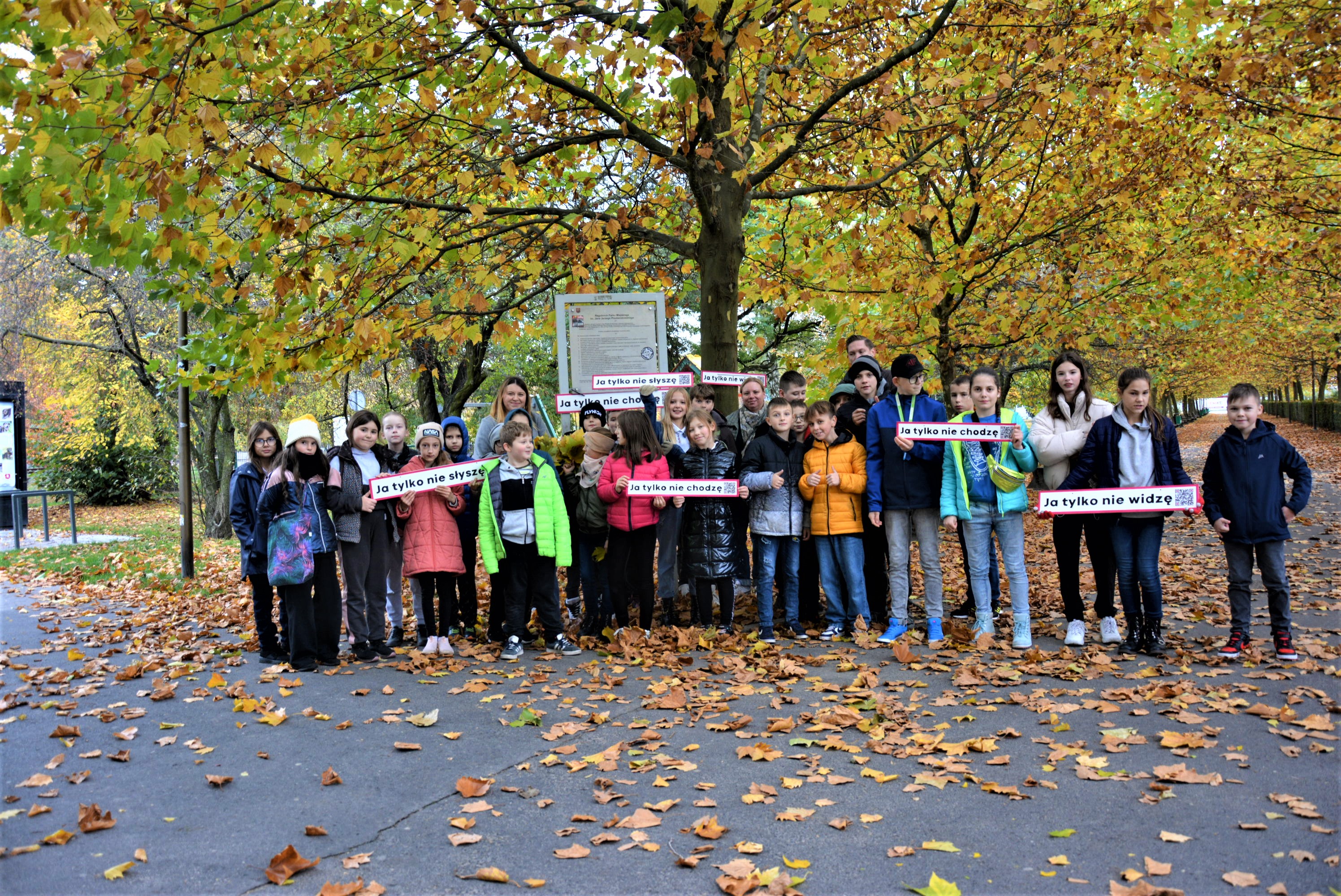 Campaign photo - young people with signs about the project