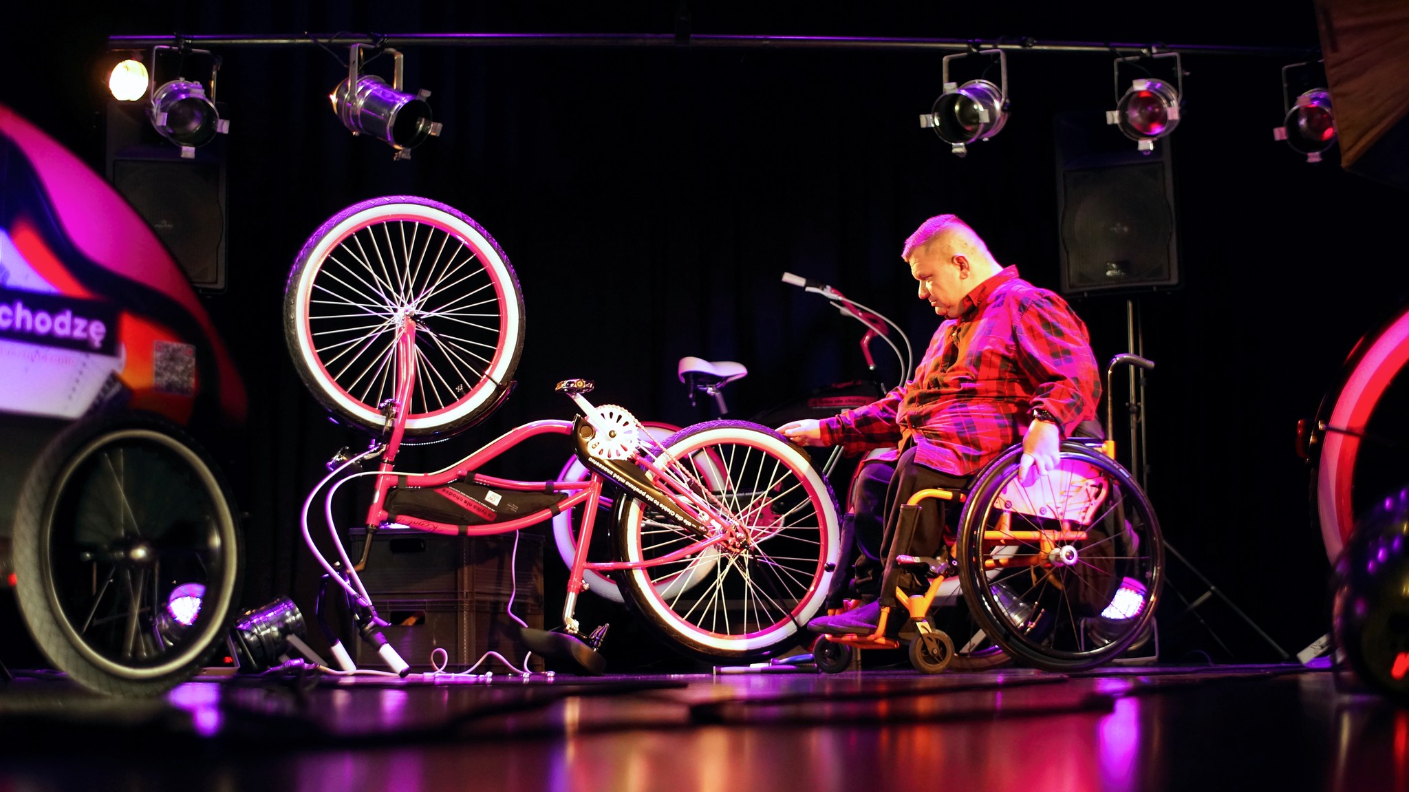 photo of a man in a wheelchair on stage